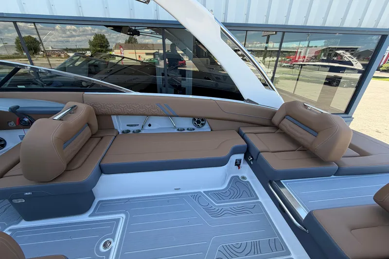 Slide: The Image of Luxurious interior of 2027 Regal LS6 boat with brown seating and modern design. - 17