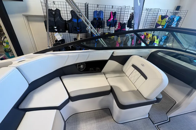 Slide: The Image of Interior of 2027 Regal 2000 ES boat with white seating and life jackets displayed. - 11