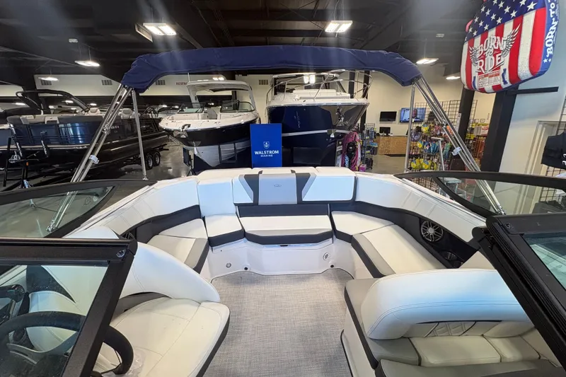 Slide: The Image of Interior view of a 2027 Regal 2000 ES boat in a showroom. - 10