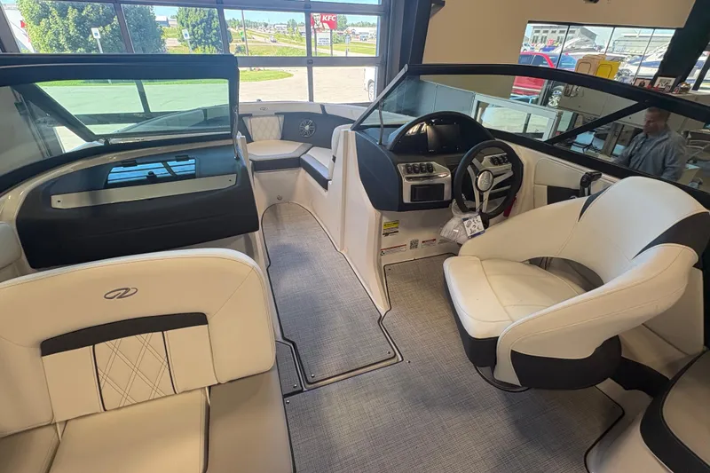 Slide: The Image of Interior of a 2027 Regal 2000 ES boat, featuring modern seating and dashboard design. - 21