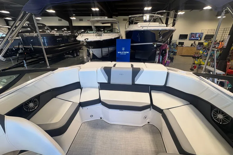 Slide: The Image of Interior of a 2027 Regal 2000 ES boat with spacious seating in a showroom. - 8