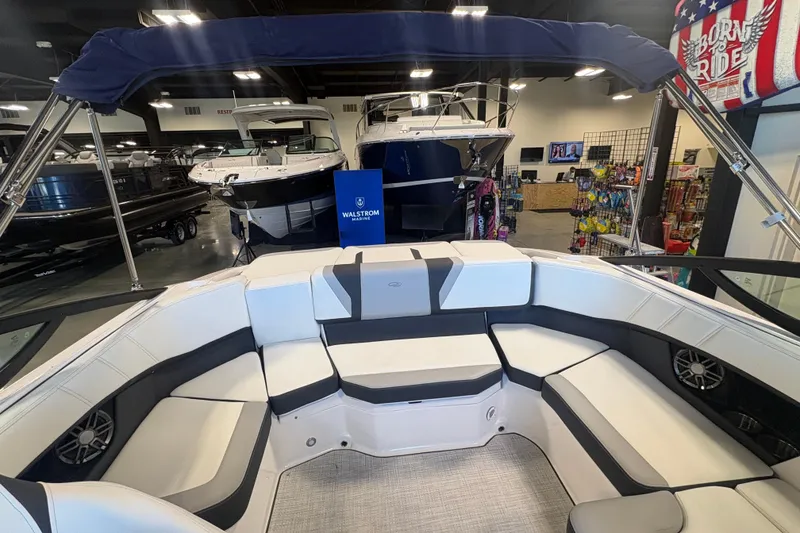 Slide: The Image of Interior view of a 2027 Regal 2000 ES boat at a showroom. - 9