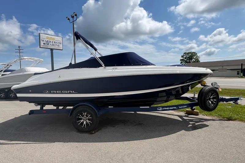 Slide: The Image of 2027 Regal 2000 ES boat on trailer at Walstrom Marine dealership. - 3