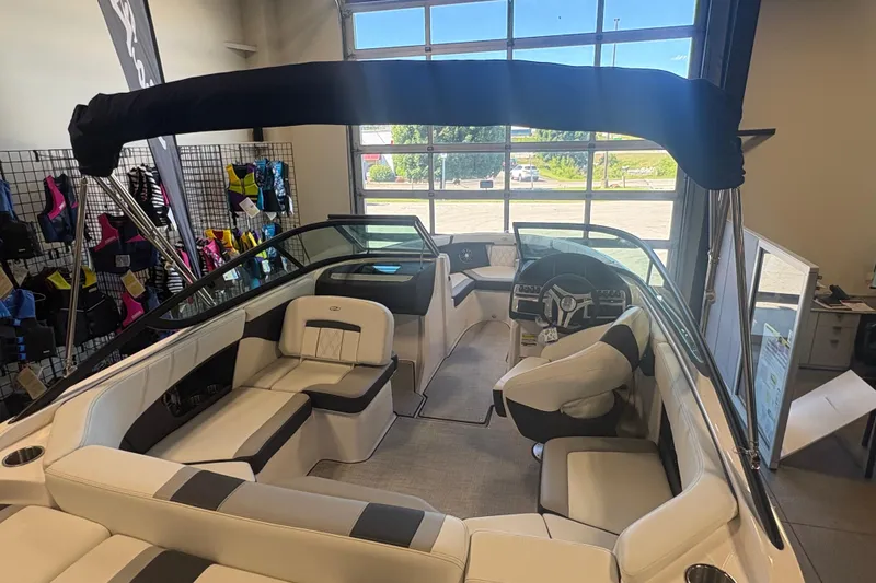 Slide: The Image of Interior view of a 2027 Regal 2000 ES boat with seating and steering wheel. - 4