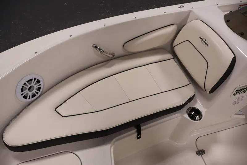 Slide: The Image of 2021 Stingray 172 SC boat interior with cushioned seating and speaker. - 15