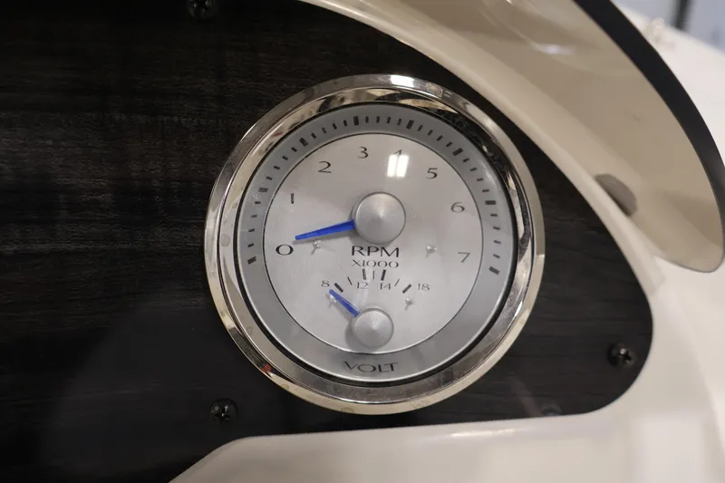 Slide: The Image of Close-up of 2021 Stingray 172 SC boat tachometer and voltmeter on dashboard. - 21