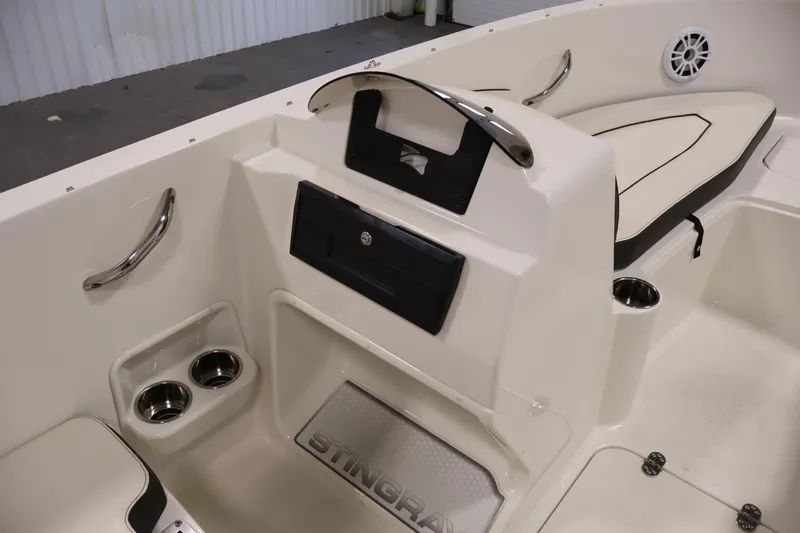 Slide: The Image of 2021 Stingray 172 SC boat interior with cup holders and seating area. - 28