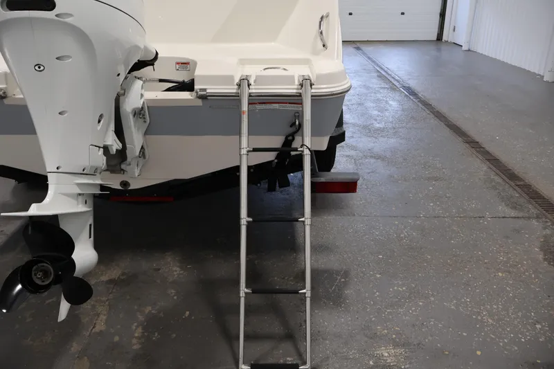 Slide: The Image of Rear view of 2021 Stingray 172 SC boat with ladder and outboard motor. - 37