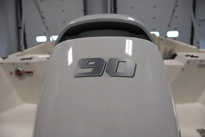 Slide: The Image of 2021 Stingray 172 SC boat interior with "90" emblem, showcasing sleek design. - 40