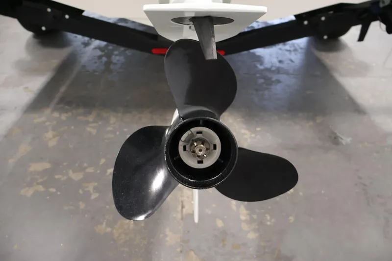 Slide: The Image of 2021 Stingray 172 SC boat propeller, close-up view in a garage setting. - 41