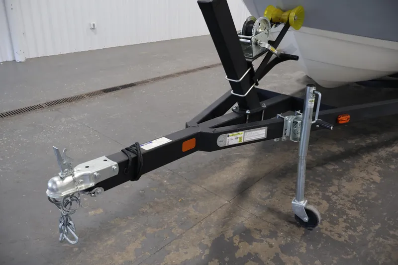 Slide: The Image of Trailer hitch of a 2021 Stingray 172 SC boat in a garage setting. - 42