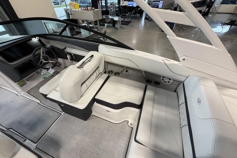 Slide: The Image of Interior of a 2027 Regal LS2 boat with luxurious white seating and modern dashboard. - 9