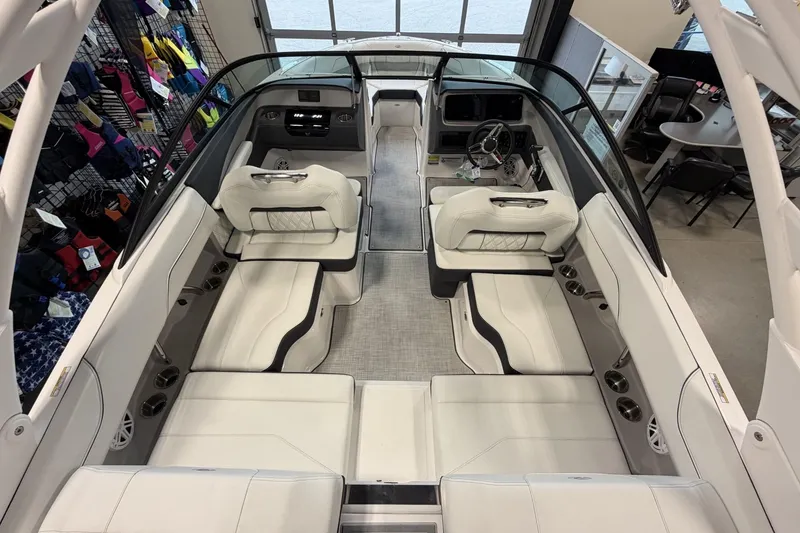 Slide: The Image of Luxurious interior of 2027 Regal LS2 boat with white seating and modern dashboard. - 12