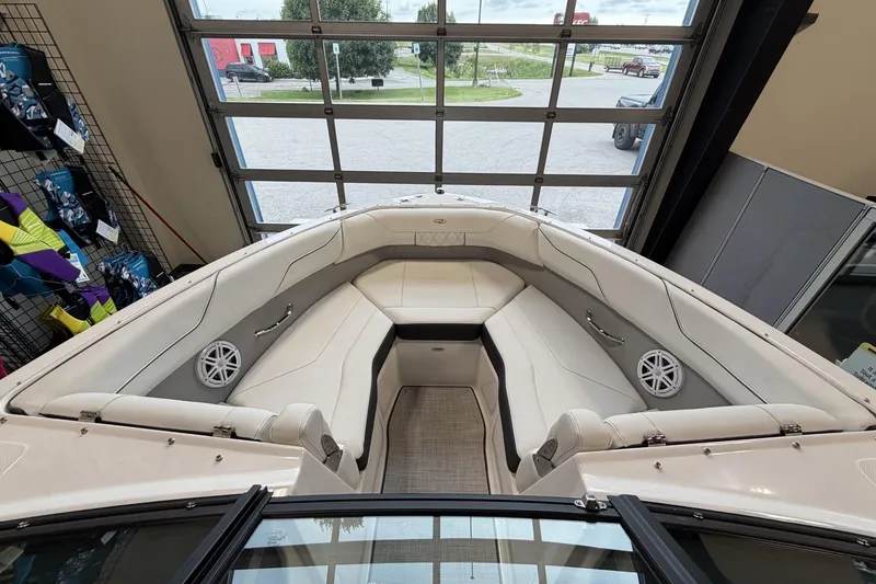 Slide: The Image of Interior view of 2027 Regal LS2 boat with white seating and speakers. - 18