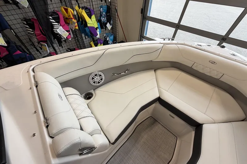 Slide: The Image of Luxurious interior of 2027 Regal LS2 boat with white seating and speaker system. - 11