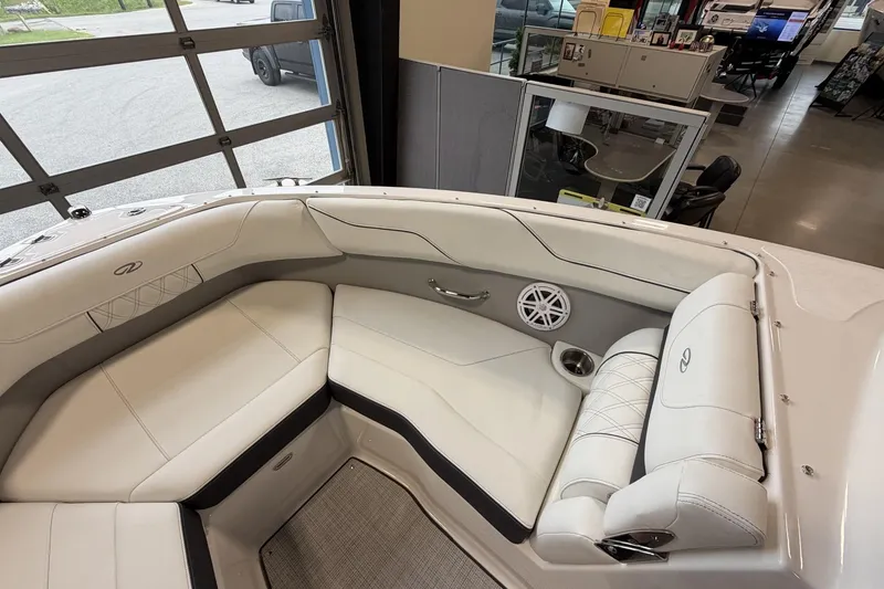 Slide: The Image of Luxurious interior of 2027 Regal LS2 boat with white seating and speaker system. - 19