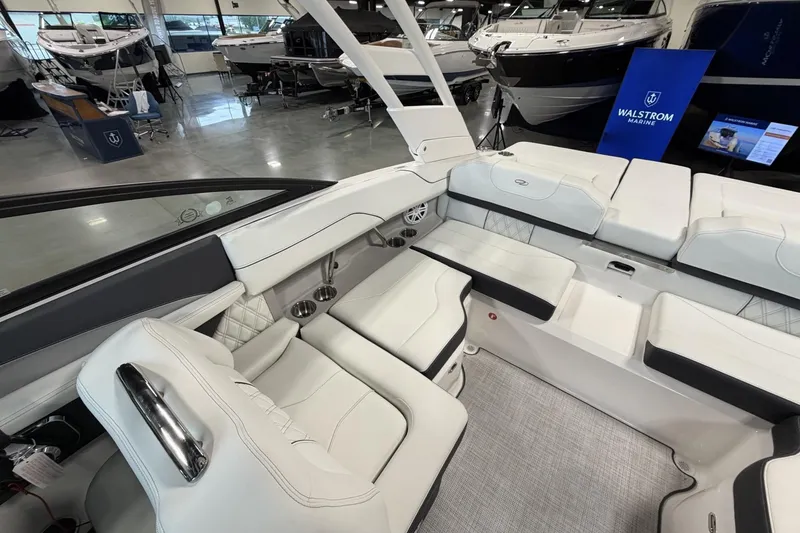 Slide: The Image of Luxurious interior of 2027 Regal LS2 boat with white seating in showroom. - 14