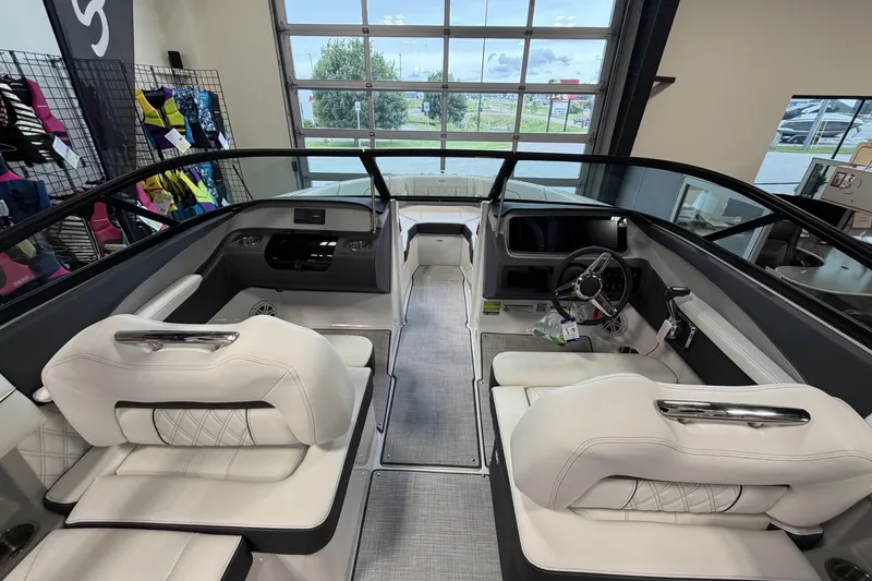 Slide: The Image of 2027 Regal LS2 boat interior with white seating and modern dashboard design. - 13