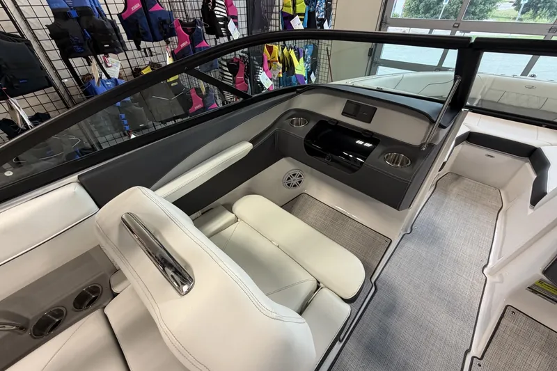 Slide: The Image of Interior of a 2027 Regal LS2 boat, featuring sleek seating and modern dashboard design. - 6