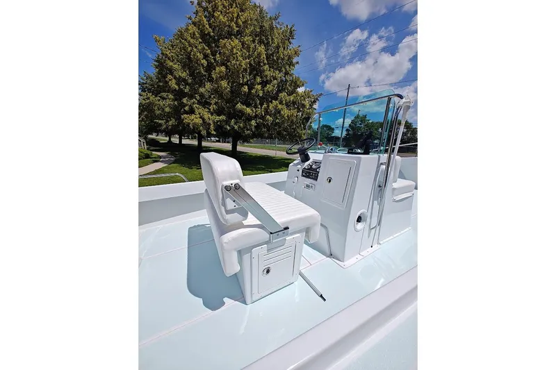 Slide: The Image of 1975 Shamrock 200 Open boat interior with white seating and steering console. - 5
