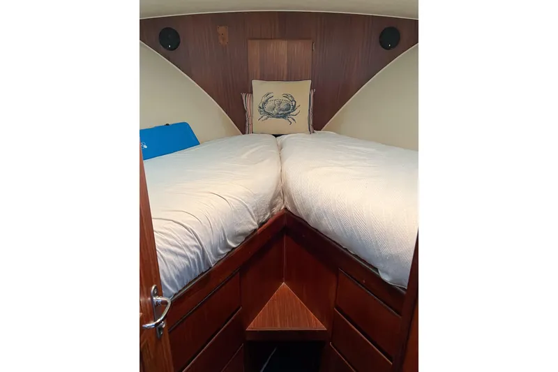 Slide: The Image of Interior cabin of 1987 Hatteras 40 Double Cabin yacht with twin beds and wooden finish. - 28
