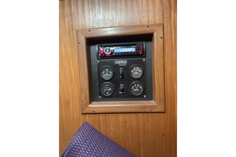 Slide: The Image of Control panel on 1987 Hatteras 40 Double Cabin yacht with gauges and stereo system. - 19