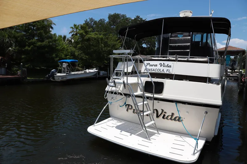 Slide: The Image of 1987 Hatteras 40 Double Cabin yacht named "Pura Vida" docked in Pensacola, Florida. - 58