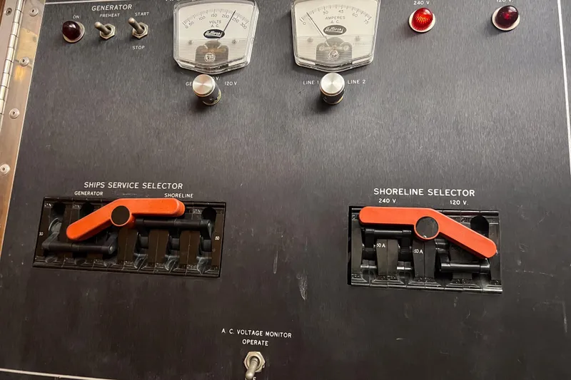 Slide: The Image of Electrical panel of a 1987 Hatteras 40 Double Cabin boat with switches and gauges. - 39