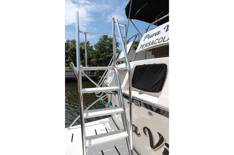 Slide: The Image of Stainless steel ladder on 1987 Hatteras 40 Double Cabin yacht in Pensacola. - 57