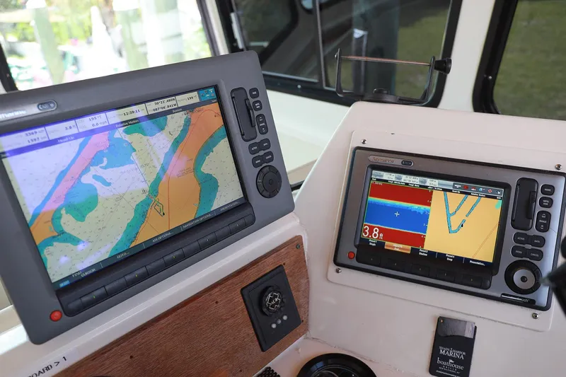 Slide: The Image of Navigation equipment on a 1987 Hatteras 40 Double Cabin yacht dashboard. - 60