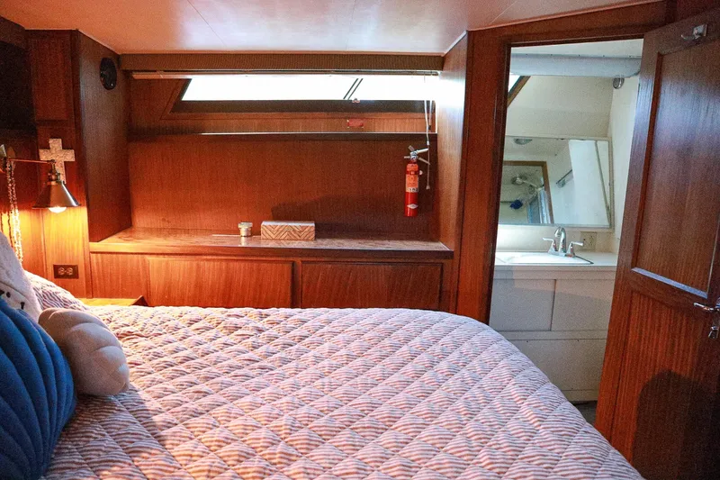 Slide: The Image of Cozy cabin interior of 1987 Hatteras 40 Double Cabin with bed and ensuite bathroom. - 46