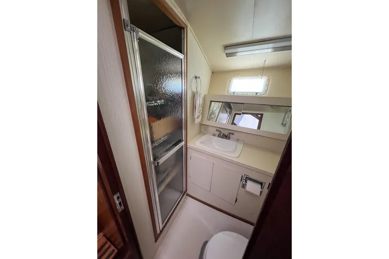 Slide: The Image of Bathroom interior of 1987 Hatteras 40 Double Cabin yacht with shower and sink. - 35