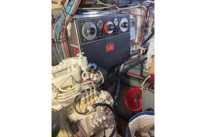 Slide: The Image of Engine room of 1987 Hatteras 40 Double Cabin with control panel and wiring. - 12
