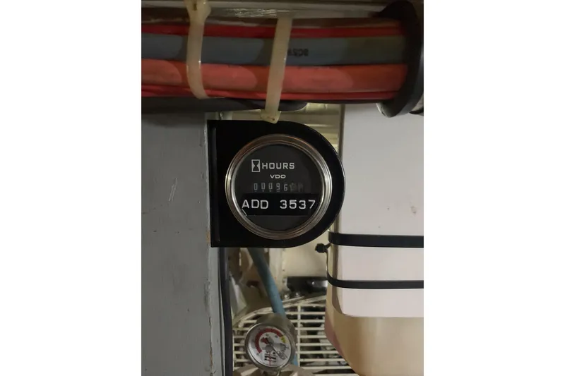 Slide: The Image of Hour meter reading on 1987 Hatteras 40 Double Cabin boat engine compartment. - 22