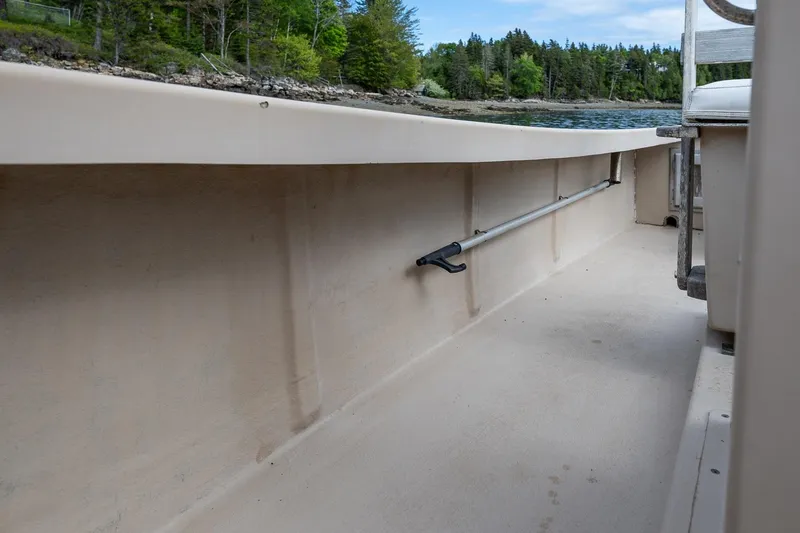 Slide: The Image of 1989 Ellis 24 Open boat interior with scenic water and forest view. - 35
