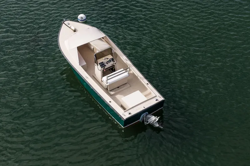 Slide: The Image of 1989 Ellis 24 Open boat on calm water, aerial view. - 19