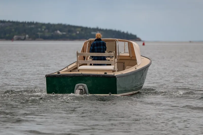 Slide: The Image of 1989 Ellis 24 Open boat cruising on calm waters, distant shoreline visible. - 9