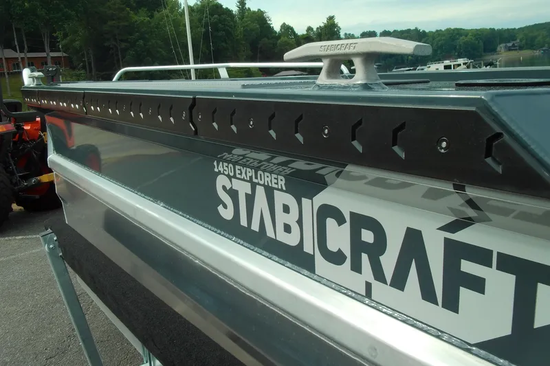 Slide: The Image of 2026 Stabicraft 1450 Explorer boat, close-up view, showcasing sleek design and branding. - 14