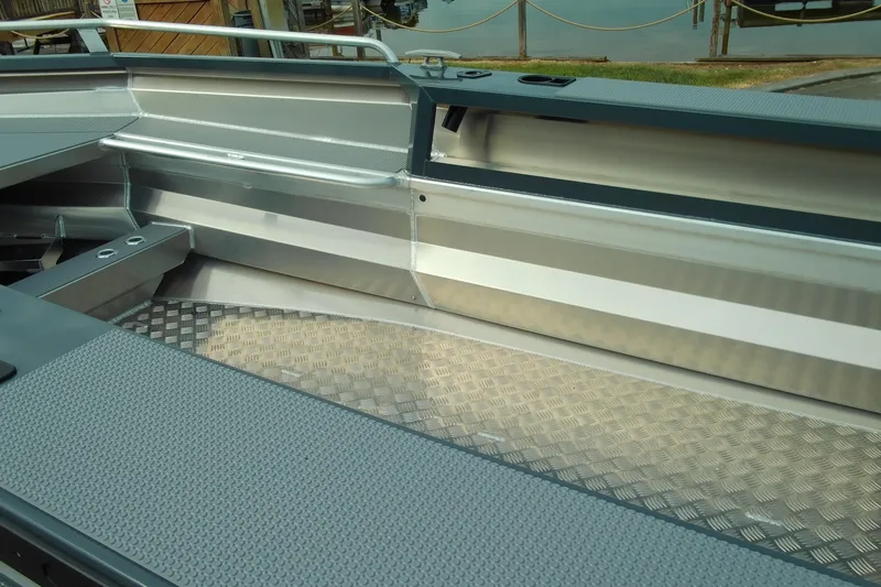 Slide: The Image of 2026 Stabicraft 1450 Explorer interior with aluminum flooring and sleek design. - 15
