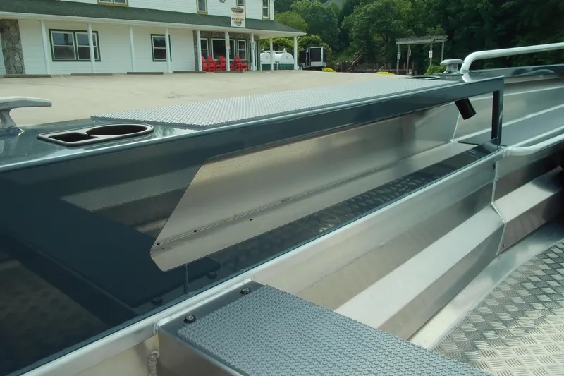 Slide: The Image of 2026 Stabicraft 1450 Explorer boat interior with aluminum finish and textured flooring. - 6