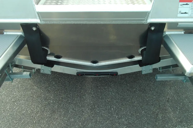 Slide: The Image of Rear view of 2026 Stabicraft 1450 Explorer boat on trailer, showing hull and support brackets. - 8