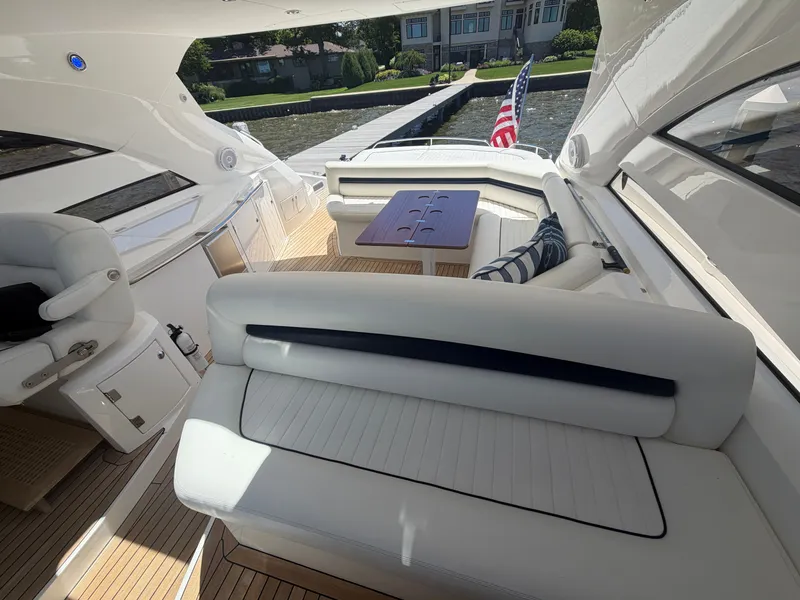 Slide: The Image of The image shows the cockpit of a 2008 Sunseeker Portofino 53 with elegant white seating. - 11