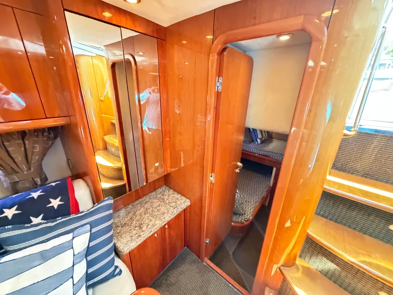 Slide: The Image of Interior of a 2008 Sunseeker Portofino 53 with wood finish and stairs. - 15