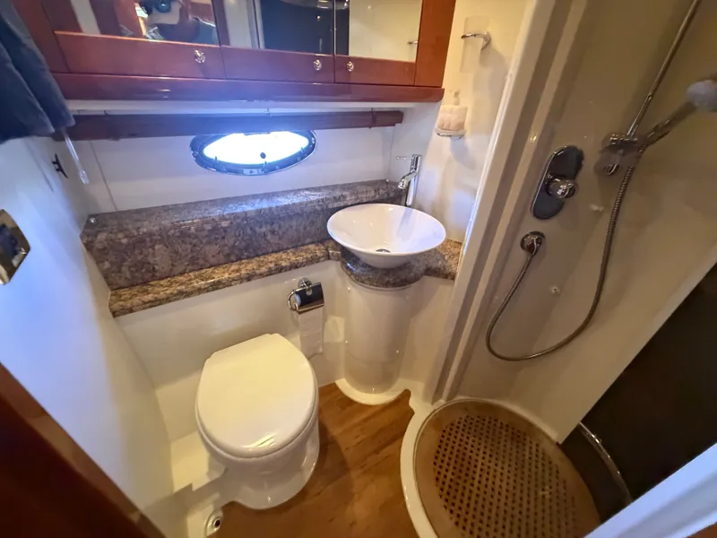 Slide: The Image of Bathroom with toilet, sink, and shower in a yacht. - 19