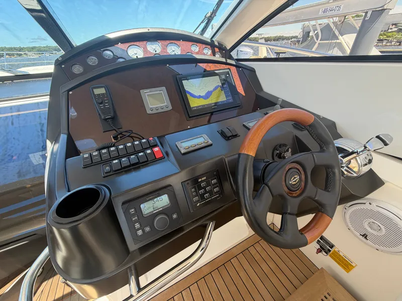 Slide: The Image of The image shows the helm of a 2008 Sunseeker Portofino 53. - 7
