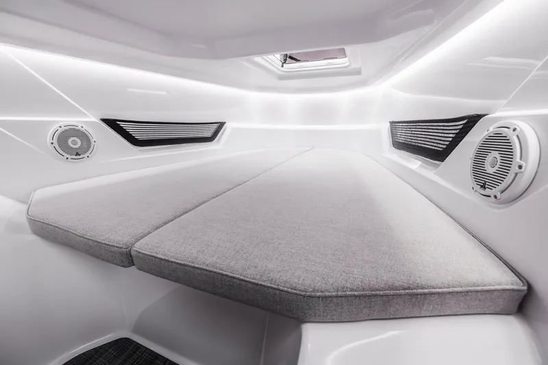 Slide: The Image of Interior of a modern boat cabin with gray cushions and built-in speakers. - 11