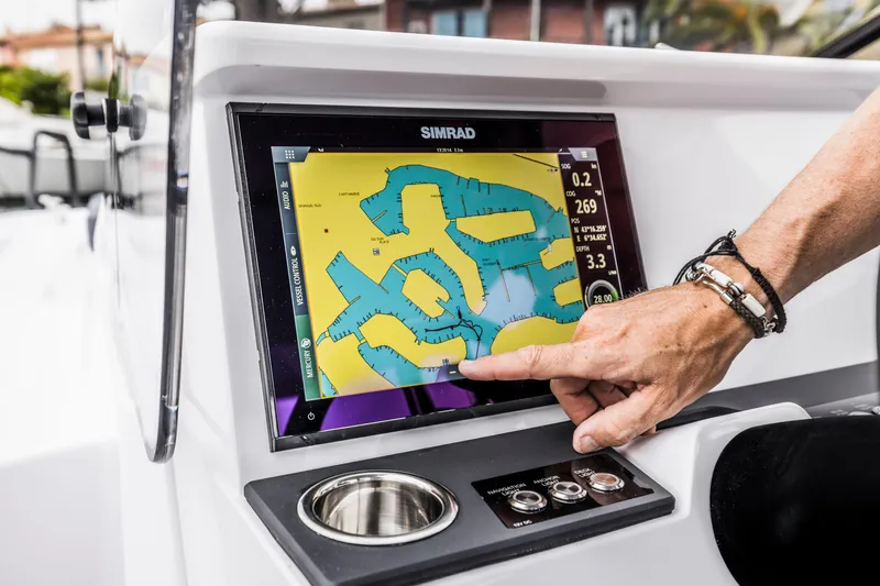 Slide: The Image of A navigation system on a boat with a map displayed on the screen. - 16