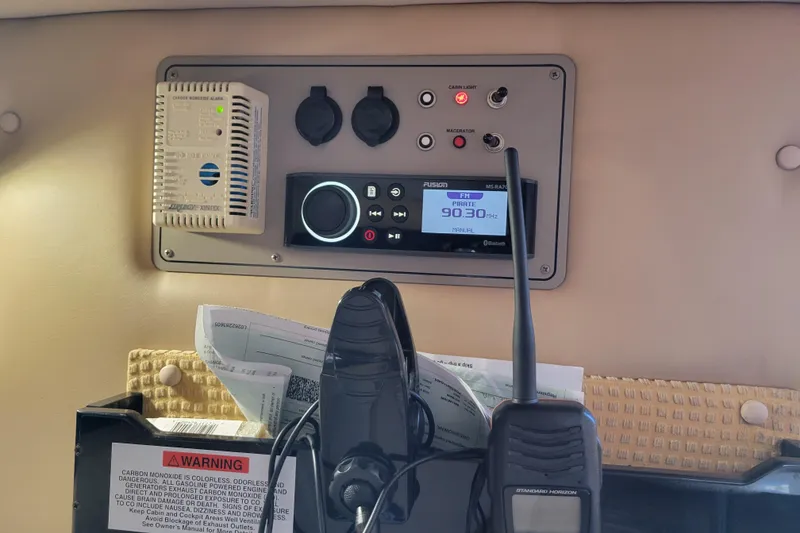 Slide: The Image of Control panel in a 2005 Cobalt 255 boat with radio and carbon monoxide alarm. - 17