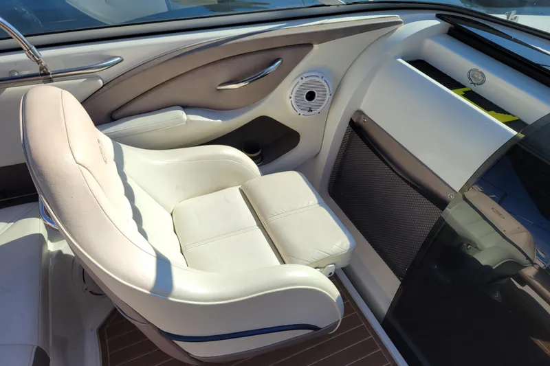 Slide: The Image of 2005 Cobalt 255 boat interior with white leather seating and modern design elements. - 9