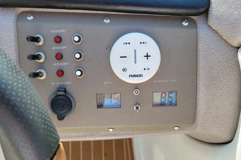 Slide: The Image of Control panel of a 2005 Cobalt 255 boat with accessory switches and temperature display. - 13